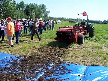 Figure 2. Collecting manure with a tarp