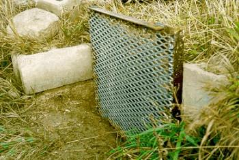 Figure 2. Farm ditch screen bolted to concrete structure. 
