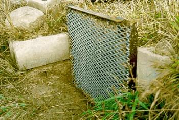 Figure 2. Farm ditch screen bolted to concrete structure.