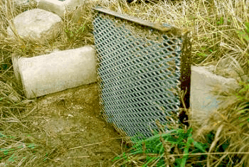 Figure 2. Farm ditch screen bolted to concrete structure.